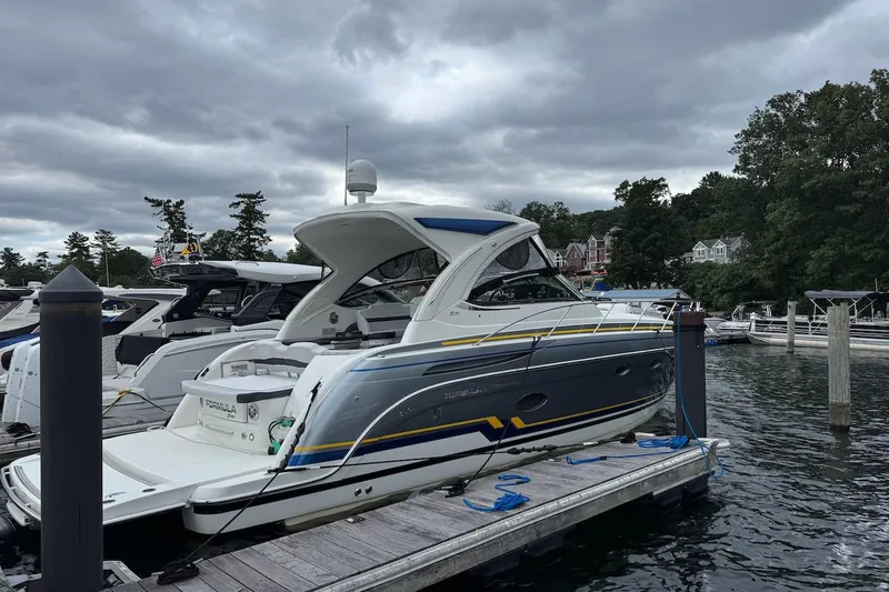  Yacht Photos Pics 2019 Formula 37 Performance Cruiser docked at a marina under cloudy skies.