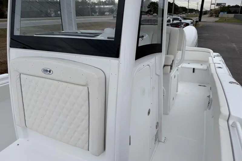  Yacht Photos Pics 2026 Sea Hunt Ultra 265 SE boat interior with white seating and sleek design.