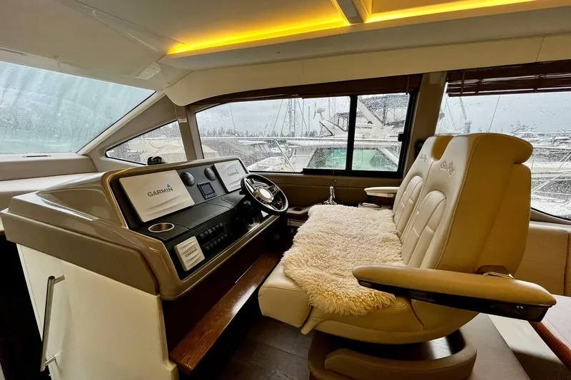 Empyrean Yacht Photos Pics Luxurious 2019 Sea Ray Sundancer 460 helm with plush seating and advanced Garmin navigation.