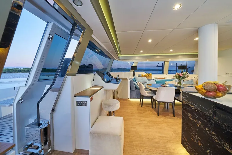 Sinata Yacht Photos Pics Luxurious interior of 2019 Sunreef 60 yacht with elegant seating and modern decor.