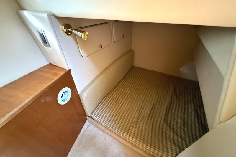 Baby Cake Yacht Photos Pics 2004 Meridian 381 Sedan interior cabin with cozy sleeping area and wooden accents.