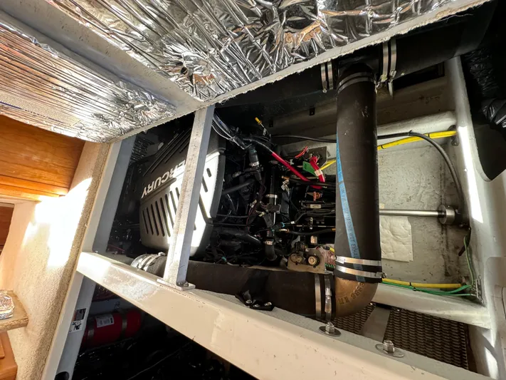 Baby Cake Yacht Photos Pics Engine compartment of a 2004 Meridian 381 Sedan with Mercury engine components.