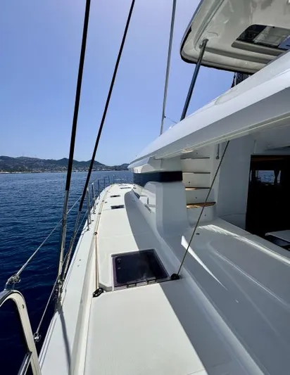  Yacht Photos Pics 2023 Lagoon 55 yacht deck with ocean view and clear sky.