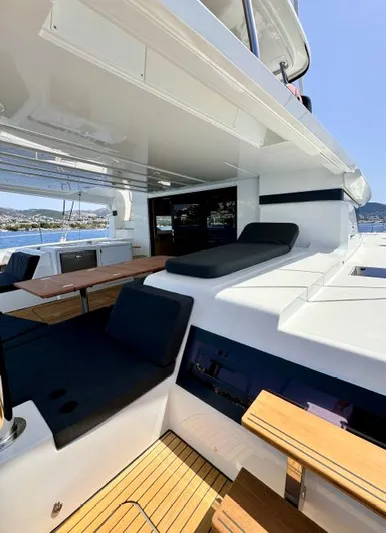  Yacht Photos Pics 2023 Lagoon 55 yacht interior with sleek seating and modern design.