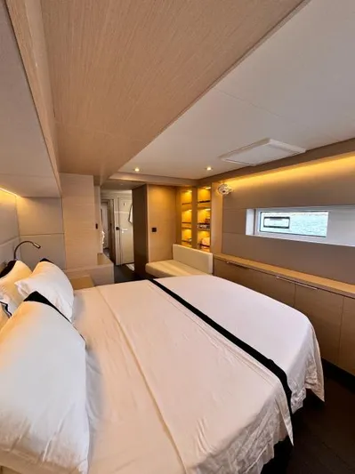  Yacht Photos Pics Luxurious interior of 2023 Lagoon 55 yacht with elegant bedroom design and modern lighting.