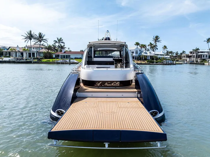 A. Noochette Yacht Photos Pics 2024 Zeelander Z5 yacht with open deck, docked in a scenic waterfront location.