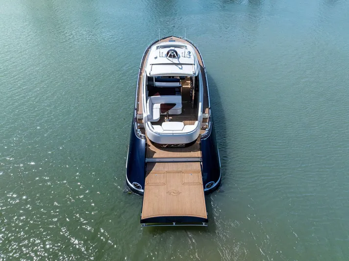 A. Noochette Yacht Photos Pics 2024 Zeelander Z5 luxury yacht on calm water, showcasing sleek design and spacious deck.