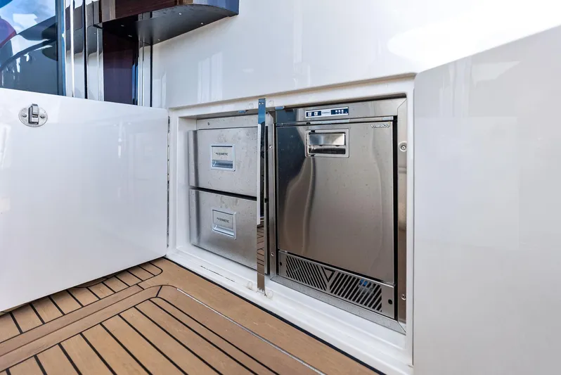 A. Noochette Yacht Photos Pics 2024 Zeelander Z5 yacht interior with stainless steel appliances and wooden flooring.