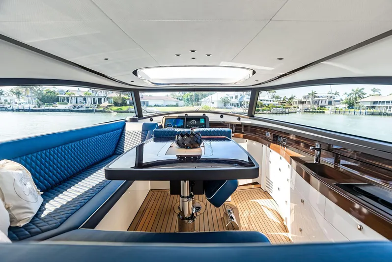 A. Noochette Yacht Photos Pics Luxurious interior of 2024 Zeelander Z5 yacht with elegant seating and panoramic windows.