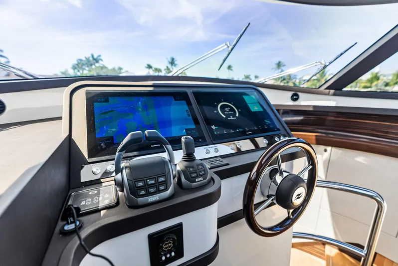 A. Noochette Yacht Photos Pics 2024 Zeelander Z5 yacht helm with advanced navigation displays and controls.