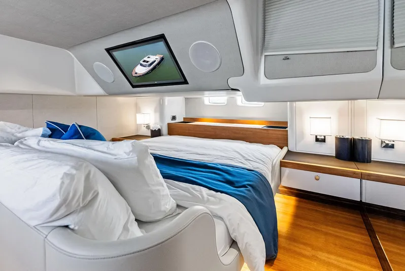 A. Noochette Yacht Photos Pics Luxurious 2024 Zeelander Z5 yacht bedroom with modern design and cozy bedding.