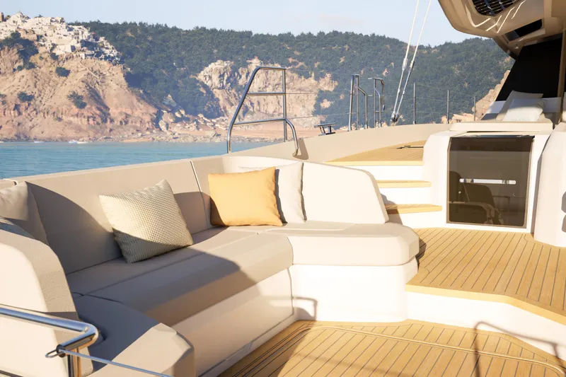 Hull #2 Fpy 70 - Coming End 2026 Yacht Photos Pics Luxurious 2027 Fountaine Pajot FPY 70 yacht deck with comfortable seating and scenic coastal view.
