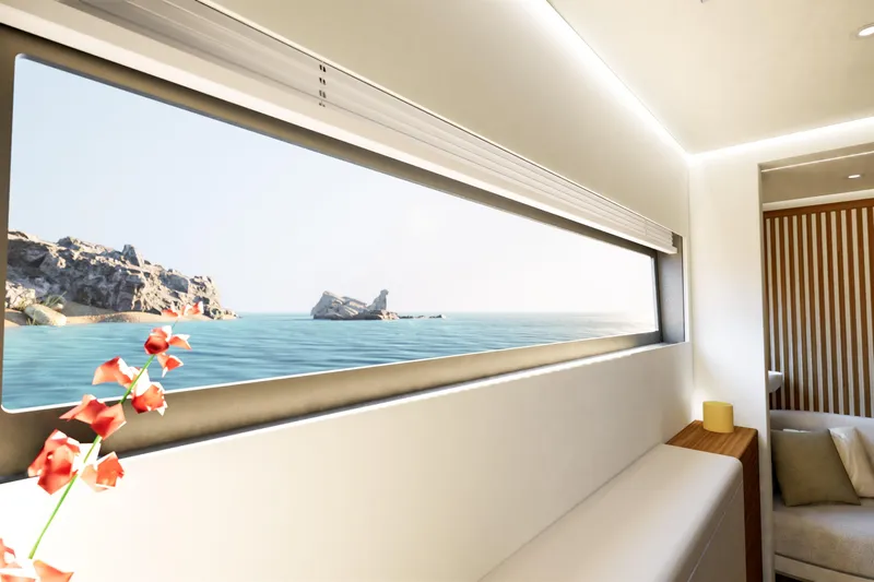 Hull #2 Fpy 70 - Coming End 2026 Yacht Photos Pics Luxurious interior view from 2027 Fountaine Pajot FPY 70 yacht, overlooking serene ocean and rocky coastline.