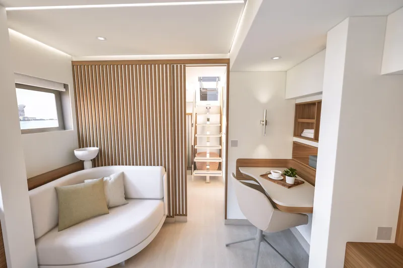 Hull #2 Fpy 70 - Coming End 2026 Yacht Photos Pics Luxurious interior of 2027 Fountaine Pajot FPY 70 yacht with modern seating and workspace.