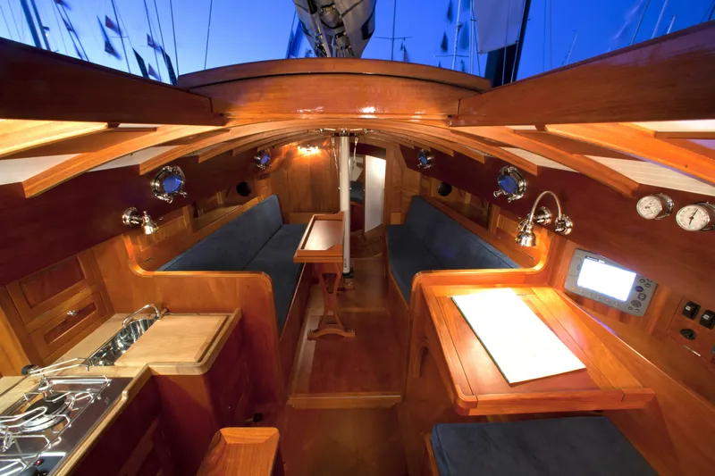 Bamboozle Yacht Photos Pics Interior of 2010 Spirit Yachts Spirit 46, featuring elegant wood finish and cozy seating.