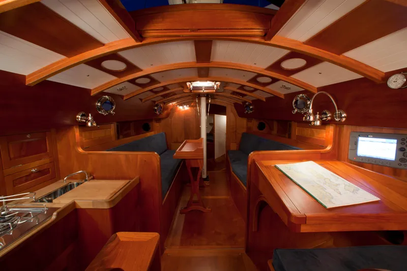 Bamboozle Yacht Photos Pics Luxurious interior of 2010 Spirit Yachts Spirit 46, featuring elegant wood finishes and cozy seating.