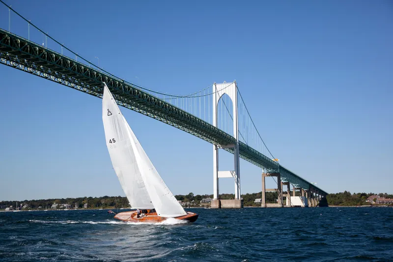 Bamboozle Yacht Photos Pics Sailboat Spirit Yachts Spirit 46 (2010) cruising under a large bridge on a sunny day.
