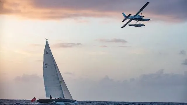 Bamboozle Yacht Photos Pics Sailboat Spirit 46 and seaplane at sunset over the ocean, 2010.