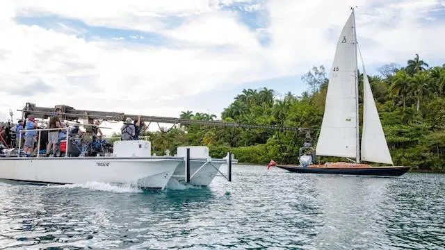 Bamboozle Yacht Photos Pics Sailboat Spirit Yachts Spirit 46 (2010) on water with film crew boat nearby.