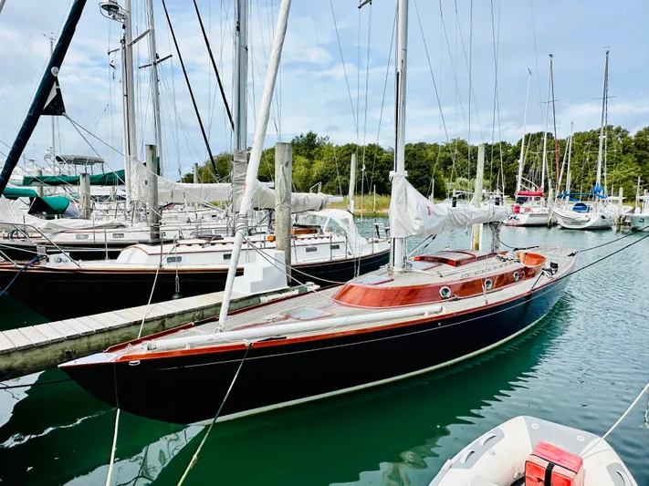 Bamboozle Yacht Photos Pics Sleek 2010 Spirit Yachts Spirit 46 sailboat docked in a marina, surrounded by other vessels.