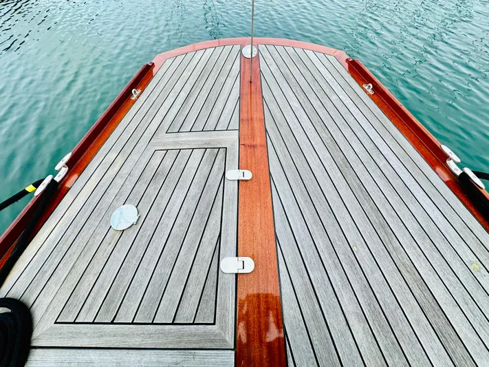 Bamboozle Yacht Photos Pics Deck of 2010 Spirit Yachts Spirit 46, featuring sleek wooden design on calm water.