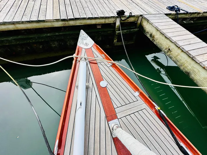 Bamboozle Yacht Photos Pics Bow of a 2010 Spirit Yachts Spirit 46 docked at a wooden pier.