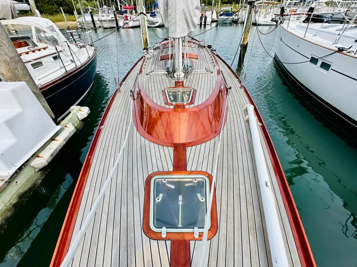Bamboozle Yacht Photos Pics Spirit Yachts Spirit 46, 2010 model, docked in a marina, showcasing elegant wooden deck design.