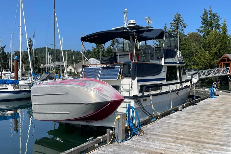Rose Petal Yacht Photos Pics 1981 Tollycraft 48 Cockpit Motor Yacht docked at marina, sunny day.
