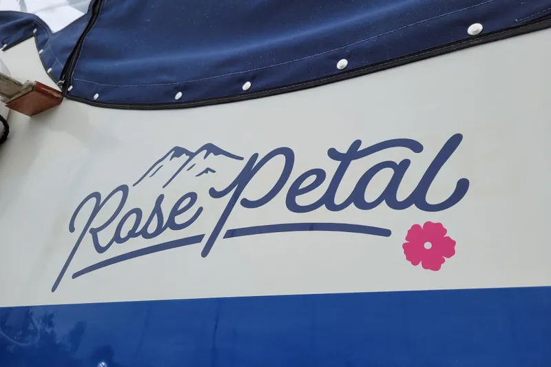 Rose Petal Yacht Photos Pics 1981 Tollycraft 48 Cockpit Motor Yacht with "Rose Petal" name and floral design.