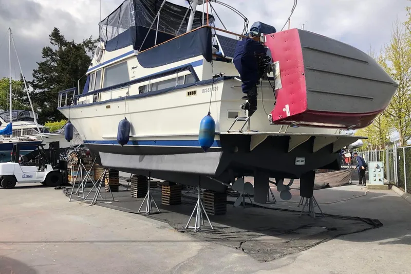 Rose Petal Yacht Photos Pics 1981 Tollycraft 48 Cockpit Motor Yacht on dry dock for maintenance.