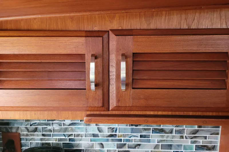 Rose Petal Yacht Photos Pics Wooden cabinet doors with metal handles on a 1981 Tollycraft 48 Cockpit Motor Yacht.