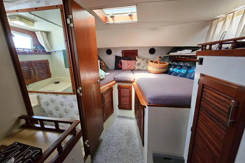 Rose Petal Yacht Photos Pics 1981 Tollycraft 48 Cockpit Motor Yacht interior with cozy cabin and wooden accents.