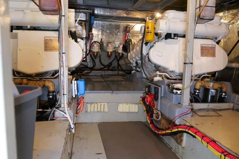 Rose Petal Yacht Photos Pics Engine room of 1981 Tollycraft 48 Cockpit Motor Yacht, showcasing dual engines and wiring.
