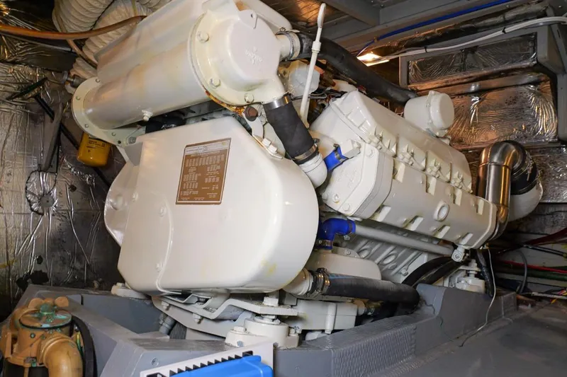 Rose Petal Yacht Photos Pics Engine room of 1981 Tollycraft 48 Cockpit Motor Yacht, showcasing machinery and components.