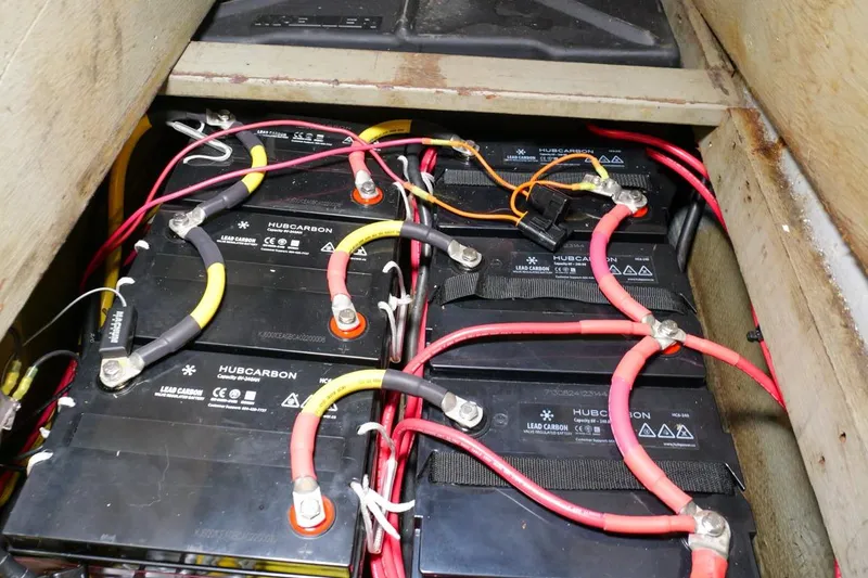 Rose Petal Yacht Photos Pics Battery compartment of a 1981 Tollycraft 48 Cockpit Motor Yacht with multiple connected batteries.