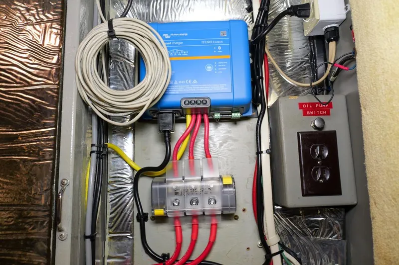 Rose Petal Yacht Photos Pics Electrical panel with wiring and oil pump switch on 1981 Tollycraft 48 Cockpit Motor Yacht.