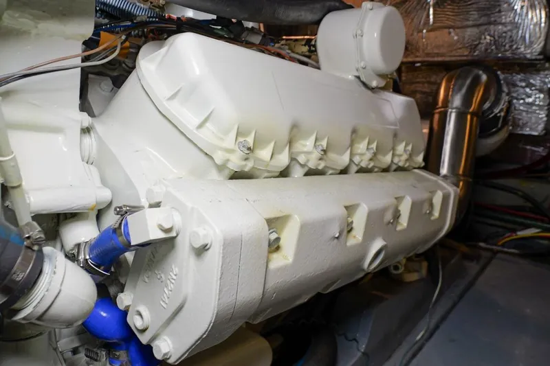 Rose Petal Yacht Photos Pics Engine room of 1981 Tollycraft 48 Cockpit Motor Yacht, showcasing machinery and components.