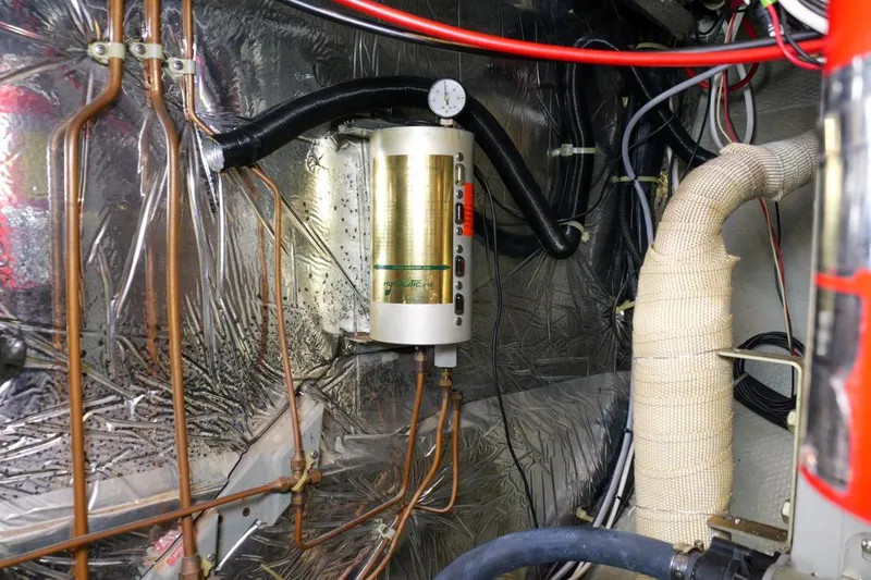 Rose Petal Yacht Photos Pics Engine room of 1981 Tollycraft 48 Cockpit Motor Yacht with wiring and piping.