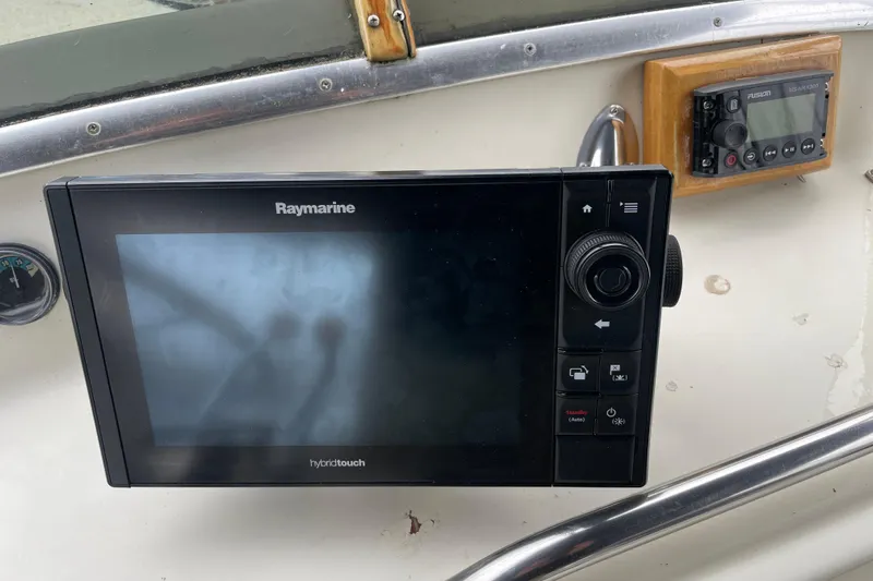 Rose Petal Yacht Photos Pics Raymarine navigation system on 1981 Tollycraft 48 Cockpit Motor Yacht dashboard.