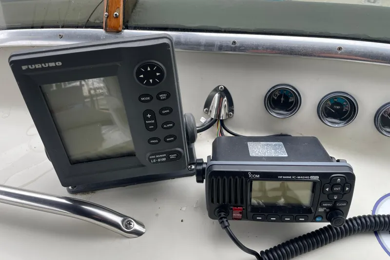 Rose Petal Yacht Photos Pics Navigation equipment on 1981 Tollycraft 48 Cockpit Motor Yacht dashboard.