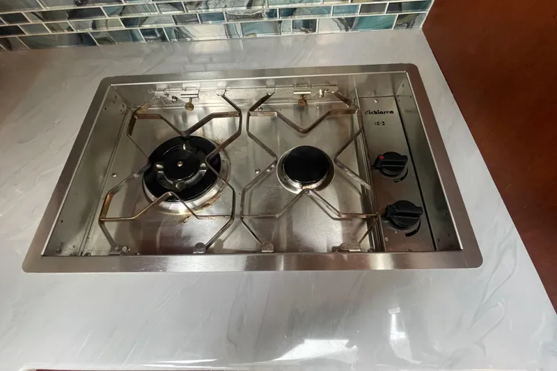 Rose Petal Yacht Photos Pics Stainless steel stove in 1981 Tollycraft 48 Cockpit Motor Yacht kitchen.