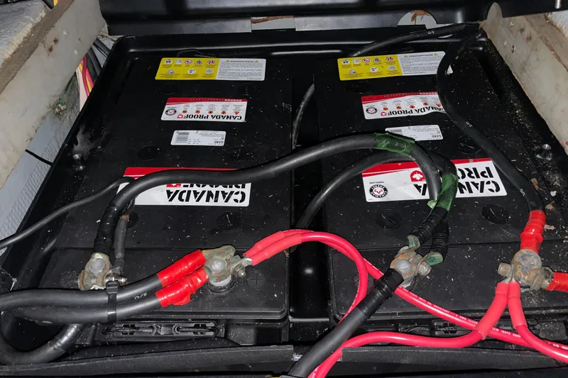 Rose Petal Yacht Photos Pics Battery compartment of 1981 Tollycraft 48 Cockpit Motor Yacht with connected cables.