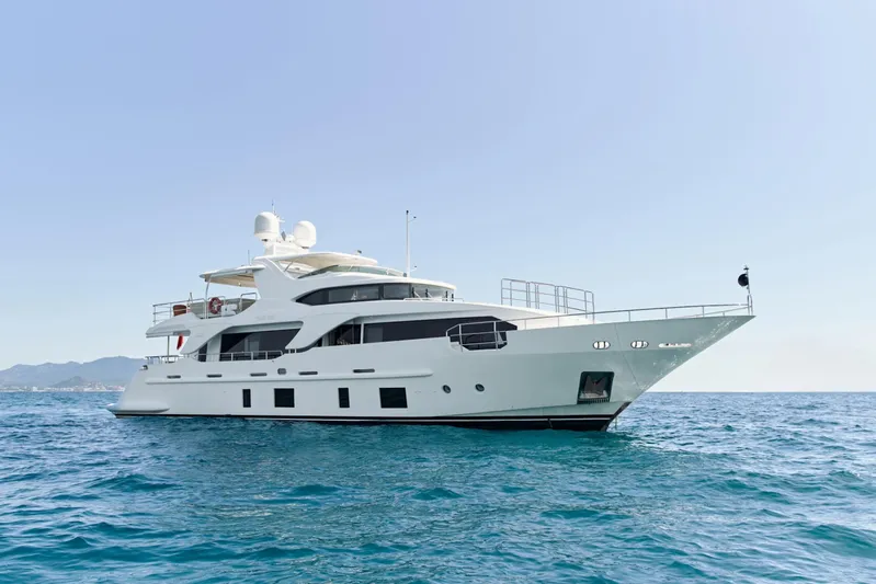 Sea Bear Yacht Photos Pics Luxury 2013 Benetti 93 Delfino yacht on open sea under clear sky.