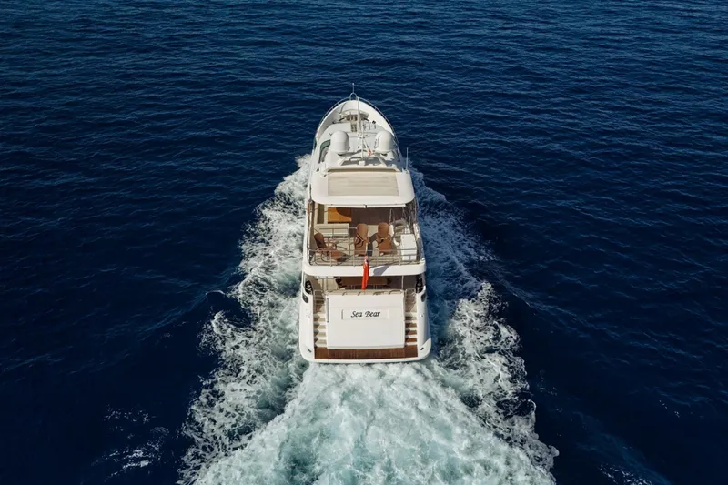 Sea Bear Yacht Photos Pics Luxurious 2013 Benetti 93 Delfino yacht cruising on open sea, aerial view.