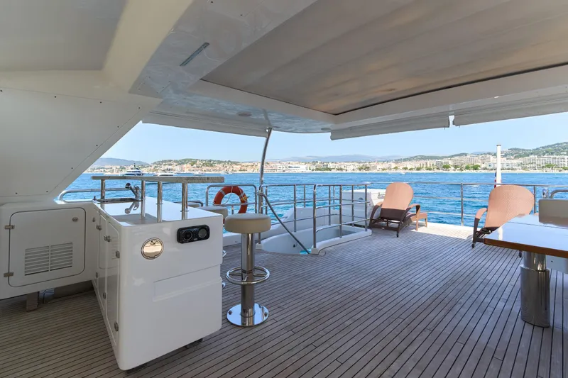 Sea Bear Yacht Photos Pics Luxurious 2013 Benetti 93 Delfino yacht deck with ocean view and seating area.