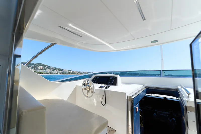 Sea Bear Yacht Photos Pics Helm of 2013 Benetti 93 Delfino yacht with ocean view and modern controls.