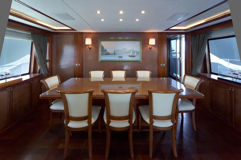 Sea Bear Yacht Photos Pics Luxurious dining area on 2013 Benetti 93 Delfino yacht with elegant wood finishes.