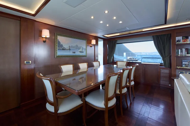 Sea Bear Yacht Photos Pics Luxurious dining area on 2013 Benetti 93 Delfino yacht with elegant wood finishes.