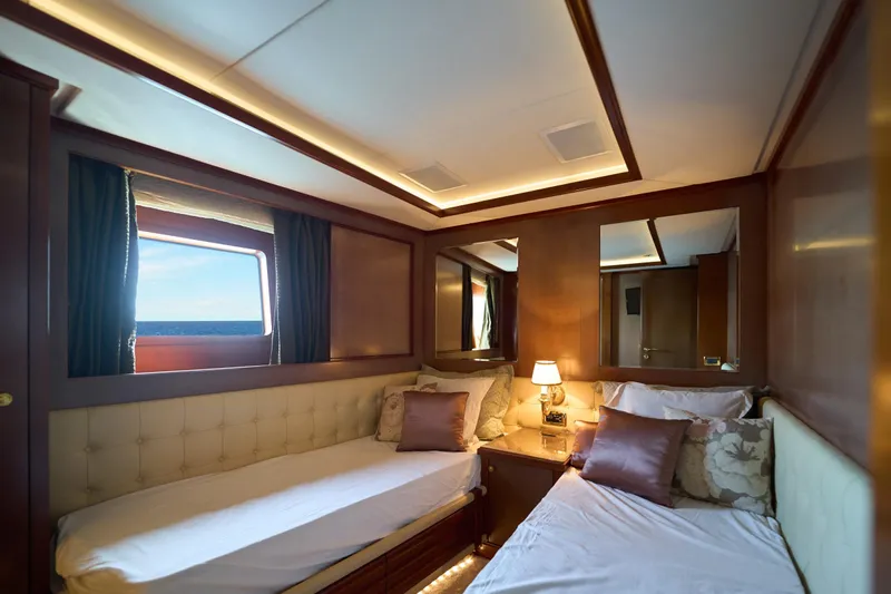 Sea Bear Yacht Photos Pics Luxurious twin cabin on 2013 Benetti 93 Delfino yacht with elegant decor and ocean view.