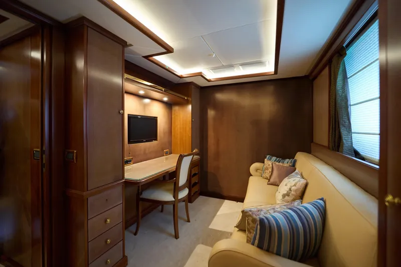Sea Bear Yacht Photos Pics Luxurious interior of 2013 Benetti 93 Delfino yacht with elegant wood paneling and cozy seating.